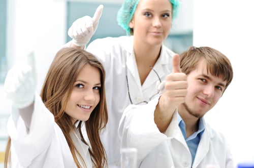 Successful teamwork inside the lab, research, young experts, thumbs up